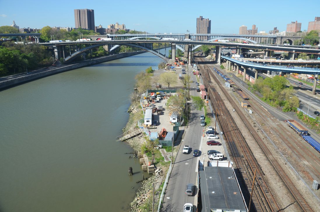 Looking north you can see the Metro-North Railroad tracks which pass under the bridges<br/>